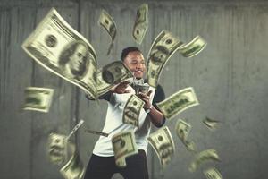black businessman making the rain of money photo