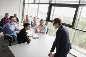 Group of young people meeting in startup office photo