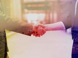 businesswoman and businessman handshake photo