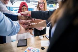 multiethnic Group of young business people celebrating success photo