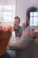 businessman working using a laptop in startup office photo