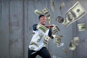 black businessman making the rain of money photo