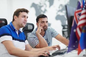 two male software developers working on computer photo