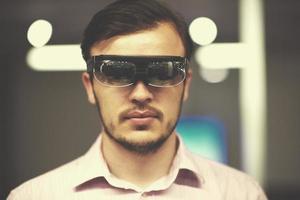 man using virtual reality gadget computer glasses photo