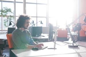 businessman working using a computer in startup office photo