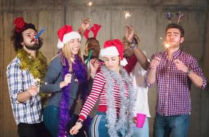multiethnic group of casual business people dancing with sparklers photo