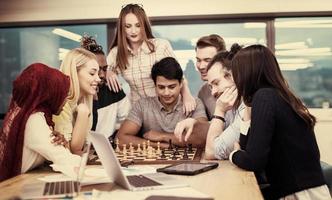 multiethnic group of business people playing chess photo