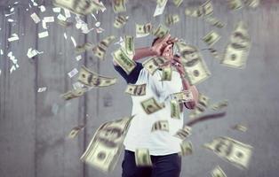 black businessman making the rain of money photo