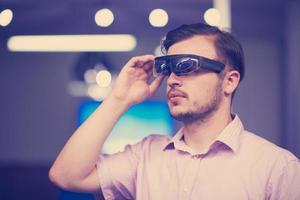 man using virtual reality gadget computer glasses photo