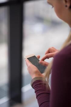 business woman using smart phone at office photo