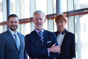 senior business man with his team at office photo