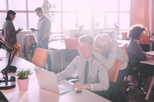 Two Business People Working With laptop in office photo