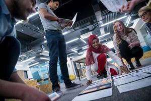 black muslim woman having meeting with Multiethnic  startup business team photo