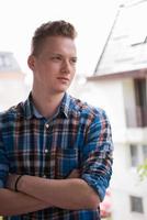 man standing at balcony photo