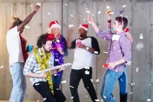 multiethnic group of casual business people having confetti party photo