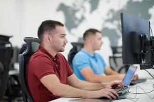 two male software developers working on computer photo