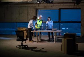 business people in group, architect and engineer on construction site photo