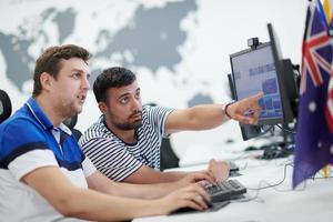 two male software developers working on computer photo
