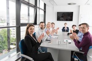 Group of young people meeting in startup office photo