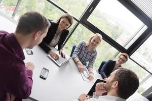 Group of young people meeting in startup office photo