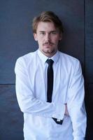 portrait of startup businessman in a white shirt with a tie photo