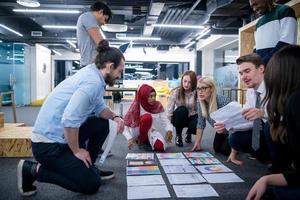 black muslim woman having meeting with Multiethnic  startup business team photo