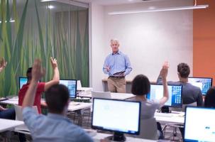 teacher and students in computer lab classroom photo