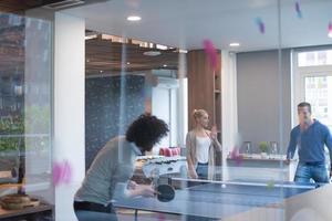 startup business team playing ping pong tennis photo