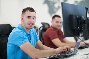 two male software developers working on computer photo
