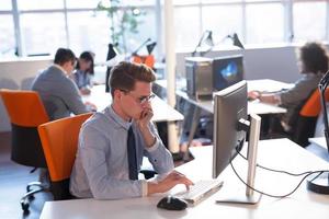 businessman working using a computer in startup office photo