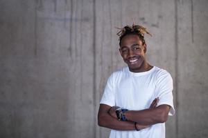 portrait of black businessman in front of a concrete wall photo