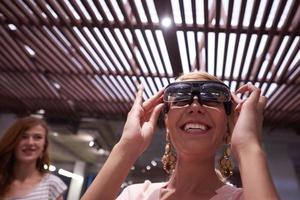 woman using virtual reality gadget computer glasses photo