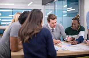 Multiethnic startup business team having meeting photo