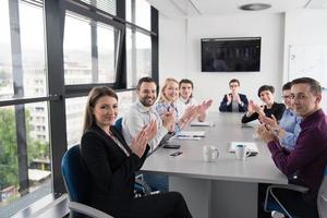 Group of young people meeting in startup office photo