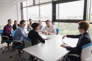 Group of young people meeting in startup office photo