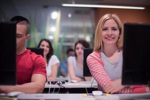 technology students group working  in computer lab school  classroom photo