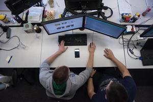 young programmers writing programming code top view photo