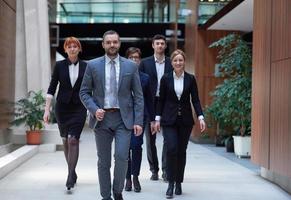 business people team walking photo