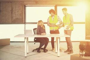 business people in group on construction site photo