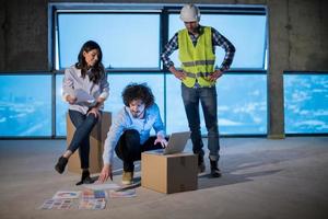 business people in group, architect and engineer on construction site photo