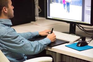 photo editor at his desk