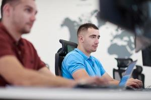 two male software developers working on computer photo