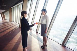 business woman group assembling jigsaw puzzle photo