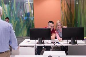 teacher and students in computer lab classroom photo