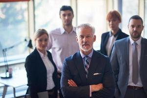 senior business man with his team at office photo