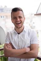 man standing at balcony photo