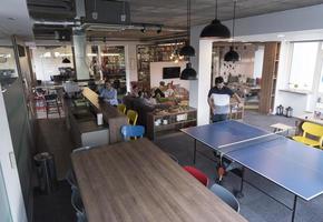 playing ping pong tennis at creative office space photo