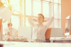 young business woman relaxing at workplace photo