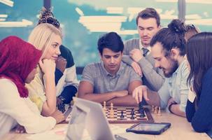 multiethnic group of business people playing chess photo