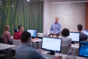 teacher and students in computer lab classroom photo